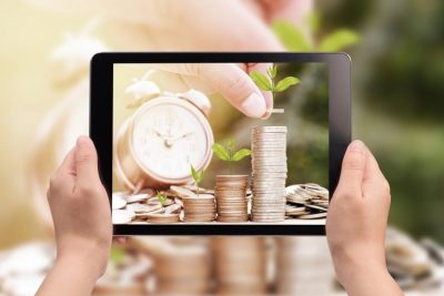 stack of growing coins and a clock, think before you act, pensions withdrawals